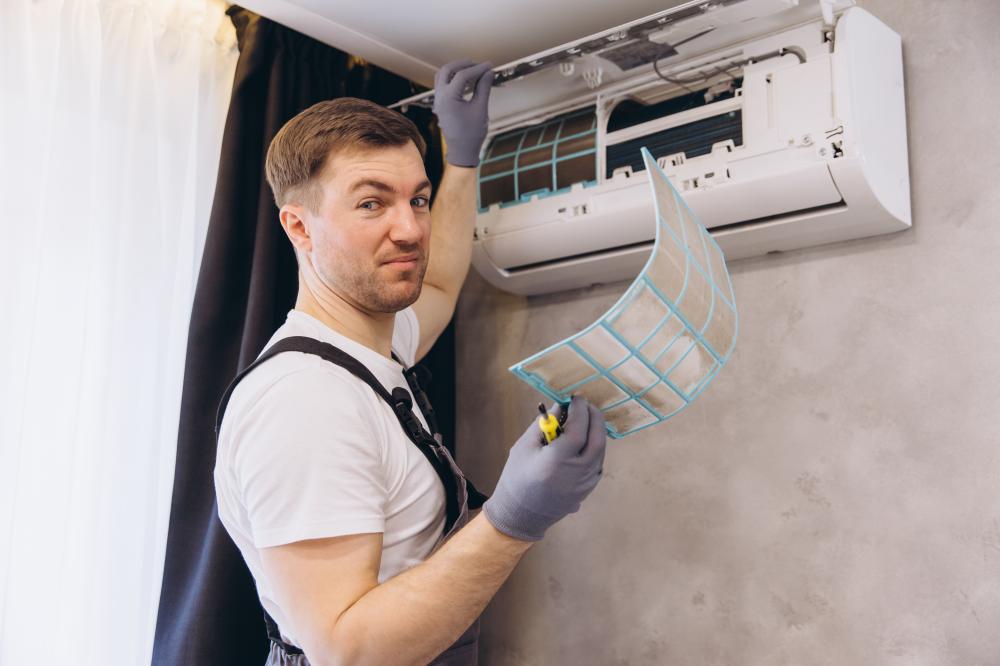 vecteezy plumber holding dirty air conditioner filter and looking 59703651 494